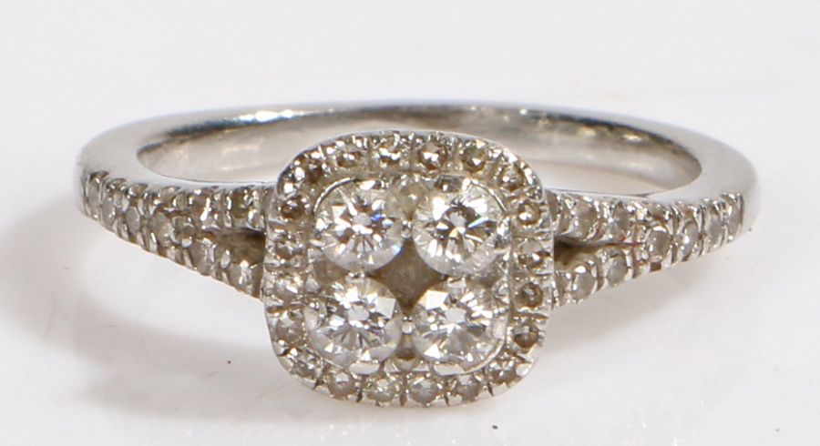 A platinum diamond cluster halo ring. Approx. total diamond carat weight: 0.40cts. Colour: H-I.