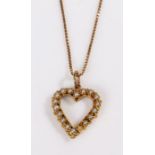 A 9ct gold pearl set heart outlined pendant suspended from a 9ct gold box chain. Measurements of