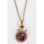 A yellow metal pendant with a round cut amethyst surrounded by round pearls, suspended from a yellow