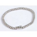 An 18ct gold diamond set bracelet. Total approx. diamond carat weight: 2.75cts. Colour: I-J.