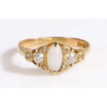 An 18ct yellow gold ring with an opal and diamonds. Approx. oval measurements: 7.4 x 3.7mm.