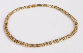 An 18ct yellow and white gold and diamond chain link necklace by Chimento, Total approx. diamond