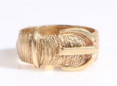 A 9ct yellow gold textured buckle ring. Width 6.72mm. Ring size M 1/2. Weighing 4.55 grams. Used, in