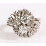 A 14ct and 18ct white gold abstract diamond cluster ring. Two central diamonds, approx. total