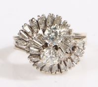 A 14ct and 18ct white gold abstract diamond cluster ring. Two central diamonds, approx. total