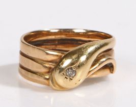 A 9ct yellow gold coiled snake ring with one diamond. Approx. diamond carat weight 0.07cts.