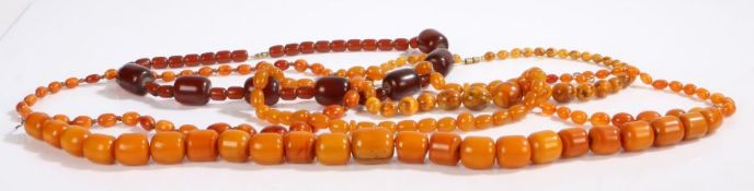 A collection of six amber necklaces. Ranging from brownish yellow to golden yellow. Transparent to
