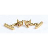 A pair of 9ct yellow gold fox chain cuff-links. Set with four rubies as eyes. Approx. total ruby