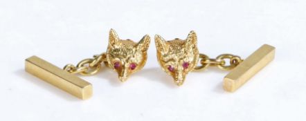 A pair of 9ct yellow gold fox chain cuff-links. Set with four rubies as eyes. Approx. total ruby