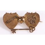 A 9ct yellow gold double heart Mizpah brooch. Measurements: 44 x 23mm. Weighing 2.80 grams. Used, in