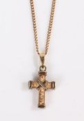A 9ct yellow gold crucifix suspended from a 9ct yellow gold chain. Diameter 16mm. Weighing 11 grams.