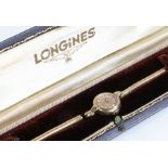 Longines ladies 9 carat gold wristwatch, the signed cream dial with baton markers and Arabic