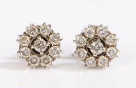 A pair of white Indian metal diamond cluster earrings. Approx. total diamond carat weight: 2.