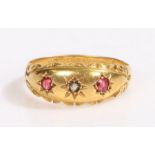 An 18ct yellow gold gypsy style ring with one ruby and two diamonds. Approx. total carat weight of