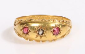 An 18ct yellow gold gypsy style ring with one ruby and two diamonds. Approx. total carat weight of