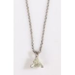 A 9ct white gold diamond solitaire pendant suspended from a 9ct white gold chain. Approx. diamond