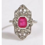 An art deco platinum ruby and diamond cluster ring. Rectangular cut ruby approx. 7.5 x 6.1 x 2.65mm.