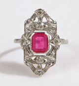 An art deco platinum ruby and diamond cluster ring. Rectangular cut ruby approx. 7.5 x 6.1 x 2.65mm.