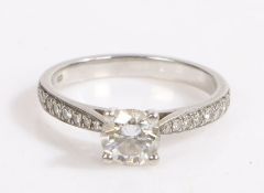 A platinum diamond solitaire ring. Approx. diamond carat weight: 0.80cts G SI2 GIA CERT  0.12cts