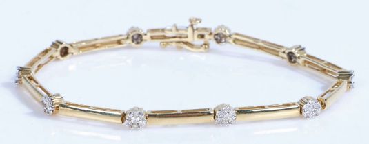 A 14ct yellow and white gold diamond set link bracelet. Approx. total diamond carat weight: 0.40cts.