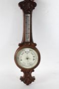 oak cased wheel barometer with shell decoration to the top together with a Smiths Arts and Crafts