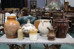 Collection of pottery to include a glazed terracotta vessel with foliate leaf decoration, burgundy