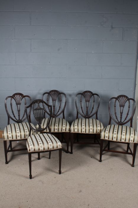 Set of four mahogany Sheraton style dining chairs, and one mahogany shield shaped dining chairs  (