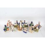 Collection of Staffordshire figure groups, to include a pair of hunting scenes, spaniels etc (11)