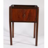 George III mahogany tray top bedside commode, the shaped gallery top above a single door and