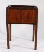 George III mahogany tray top bedside commode, the shaped gallery top above a single door and