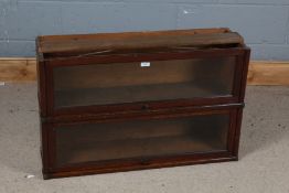 Two sections of Global-Wernicke oak bookcase both with glazed doors and baring a label