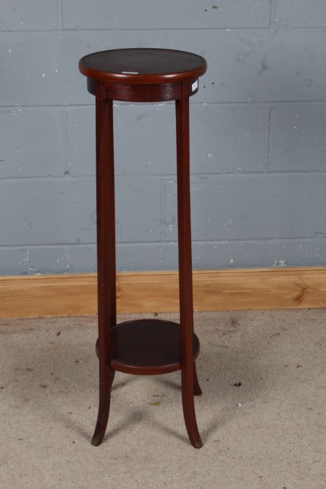 Mahogany jardiniere stand, the circular top with an under tier, 99cm high