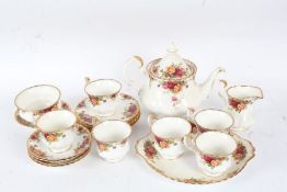 Collection of Royal Albert Country Roses tea service to include tea pot cups and saucers plates