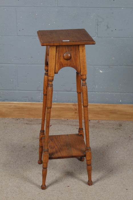 20th century oak Arts and Crafts style jardiniere stand, the square top with an under tier and