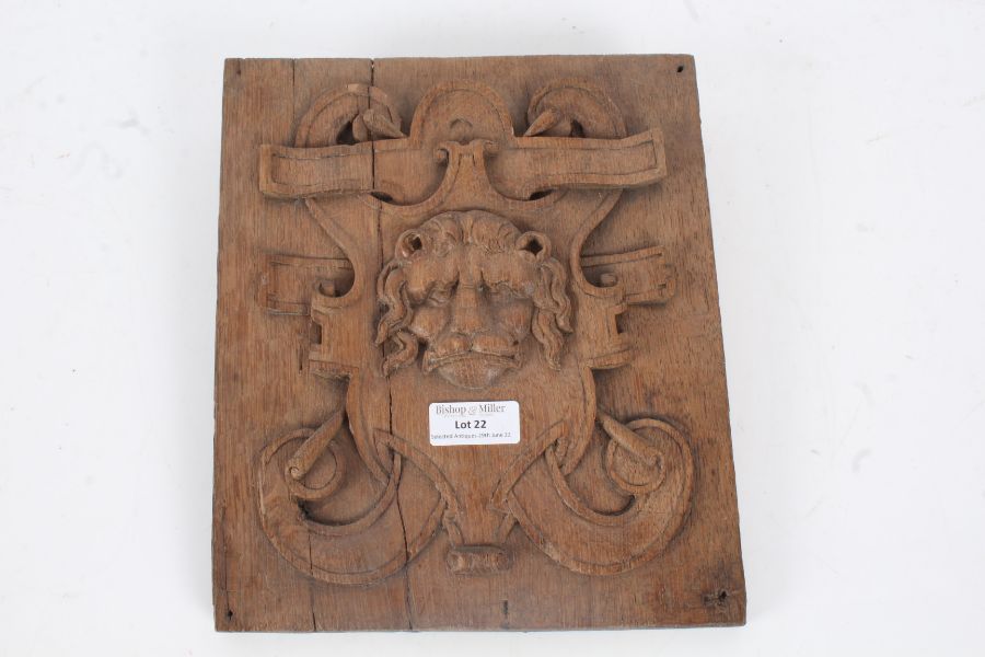 An 19th Century carved oak panel, the square panel designed with a lions head to the centre with a