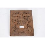 An 19th Century carved oak panel, the square panel designed with a lions head to the centre with a