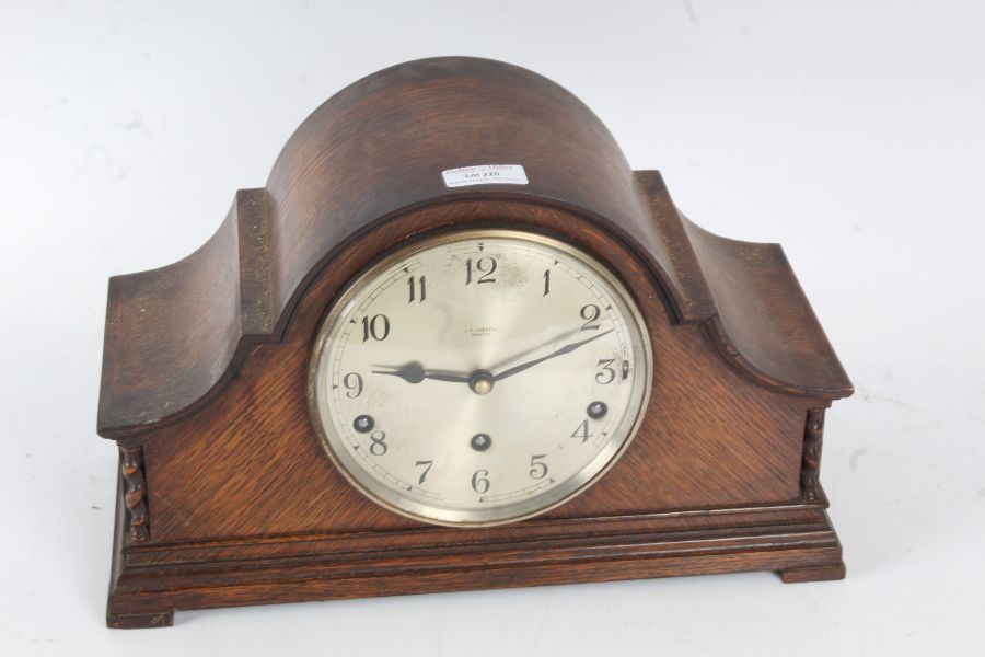 J. A. Haskell of Ipswich oak cases mantle clock with a silvered dial and Arabic numerals with a
