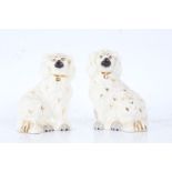 Pair of Beswick Spaniels, the white ground with gold accents, 15cm high (2)