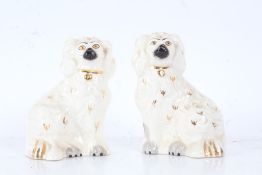 Pair of Beswick Spaniels, the white ground with gold accents, 15cm high (2)
