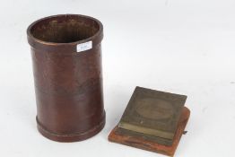 20th century tooled leather bin with foliate decoration together with a brass and oak hanging letter