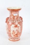 Japanese Kutani vase, the iron red ground with floral scenes and scenes of a peacock to the neck