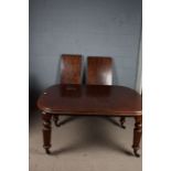 Victorian mahogany extending dining table with two additional leaves, the top with chamfered