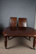 Victorian mahogany extending dining table with two additional leaves, the top with chamfered