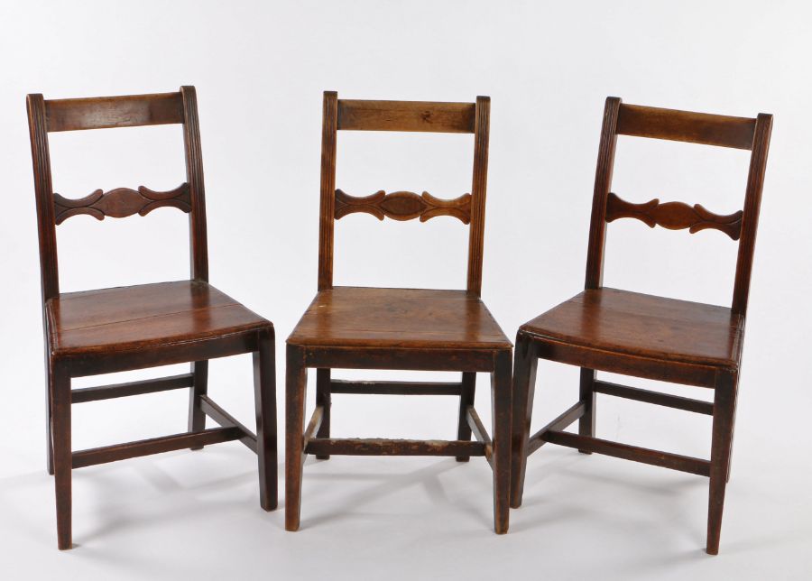 Three 19th Century mahogany country dining chairs, having shaped back rests, rail side supports