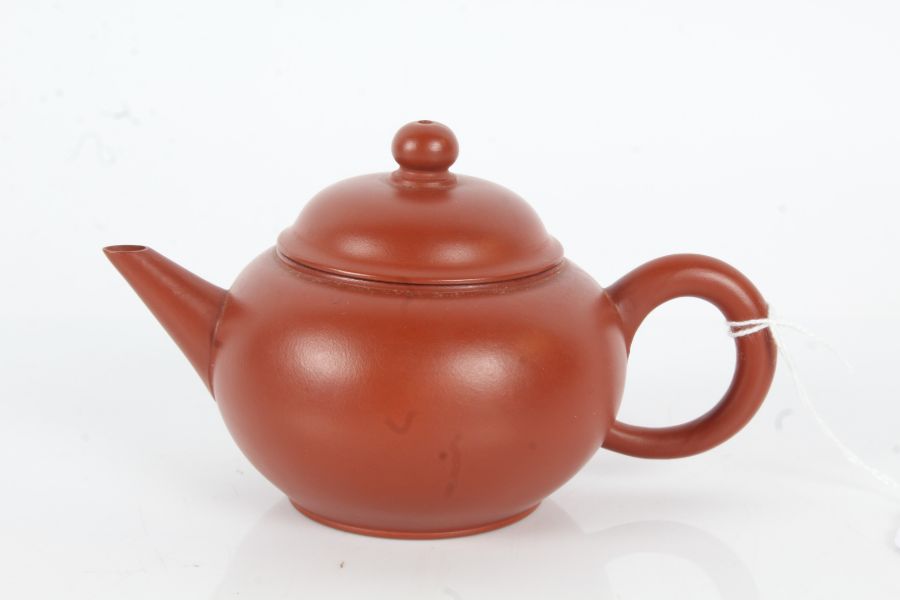 Chinese terracotta teapot, of bulbous form, plain body, character marks to base and QF collection