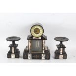 A black slate clock garniture, with a white dial with Arabic numerals, with a mercurial pendulum,