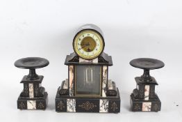 A black slate clock garniture, with a white dial with Arabic numerals, with a mercurial pendulum,