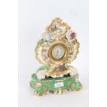 20th century porcelain mantle clock, the gold, green and white ground decorated with flowers made by