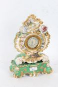 20th century porcelain mantle clock, the gold, green and white ground decorated with flowers made by