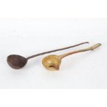 George II horn toddy ladle inset with a George II shilling together with a 19th century iron